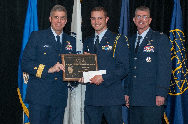 In April, Adm. Abel (l) joins Col. Scott Owens, USAF (r), chapter vice president for ROTC affairs, in congratulating Cadet James O'Connor, Air Force ROTC, Worcester Polytechnic Institute, as the chapter's ROTC Gen. Bernard Schriever Scholarship Award winner.